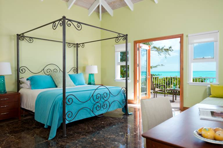 Oceanfront King master bedroom with private balcony at Casa Varnishkes, Providenciales