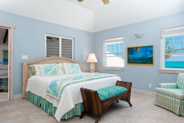 Beachfront King master bedroom at Serenity House Providenciales